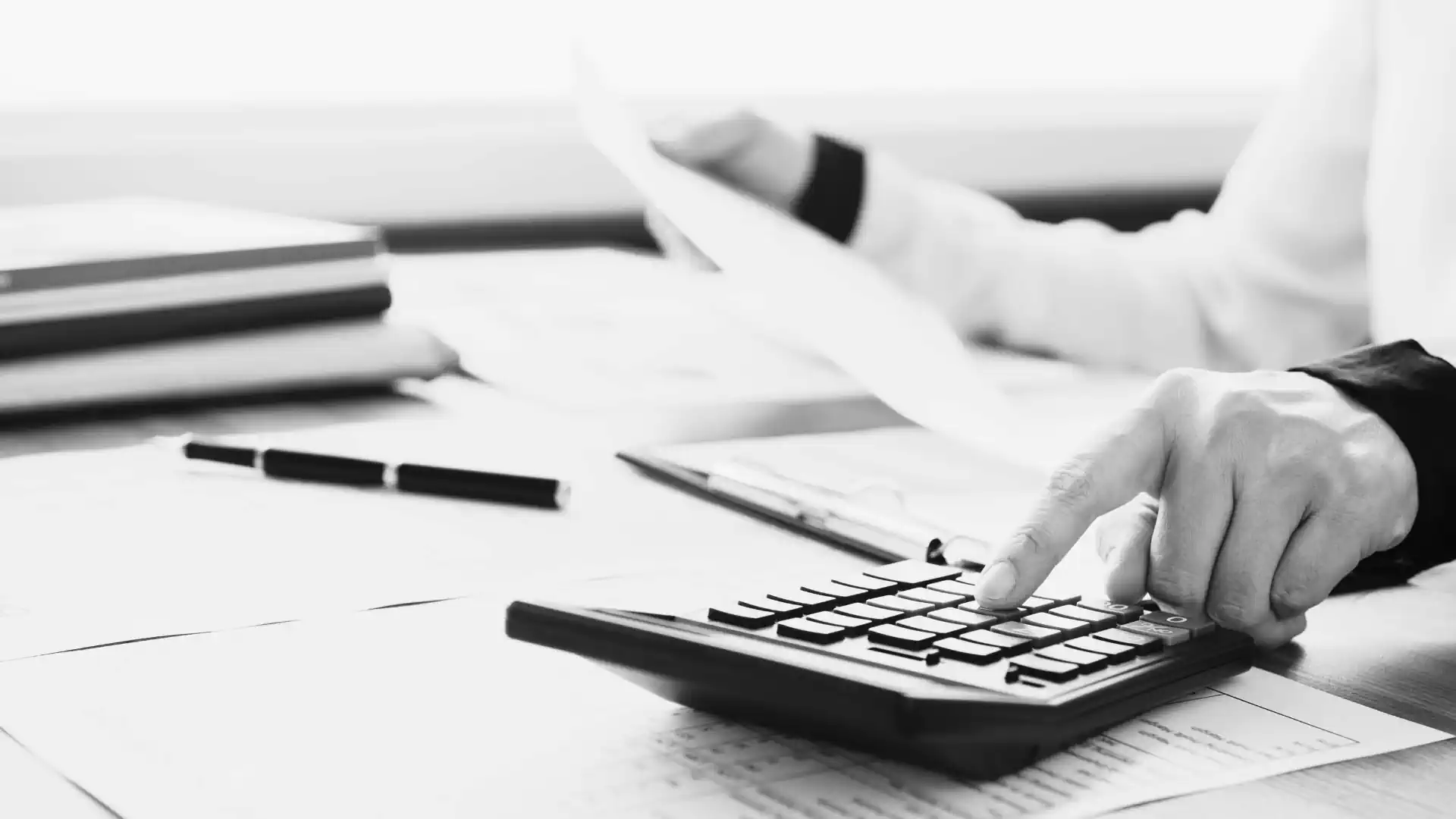 Reviewing IT costs and invoices with a calculator